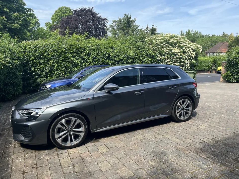 Grey Audi photographed on a residential driveway
