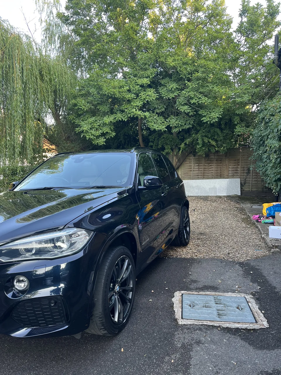 Black BMW X5 parked on a driveway