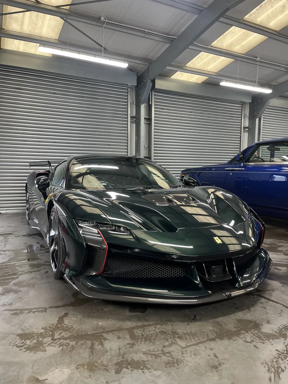 Dark green Ferrari with a high-gloss finish